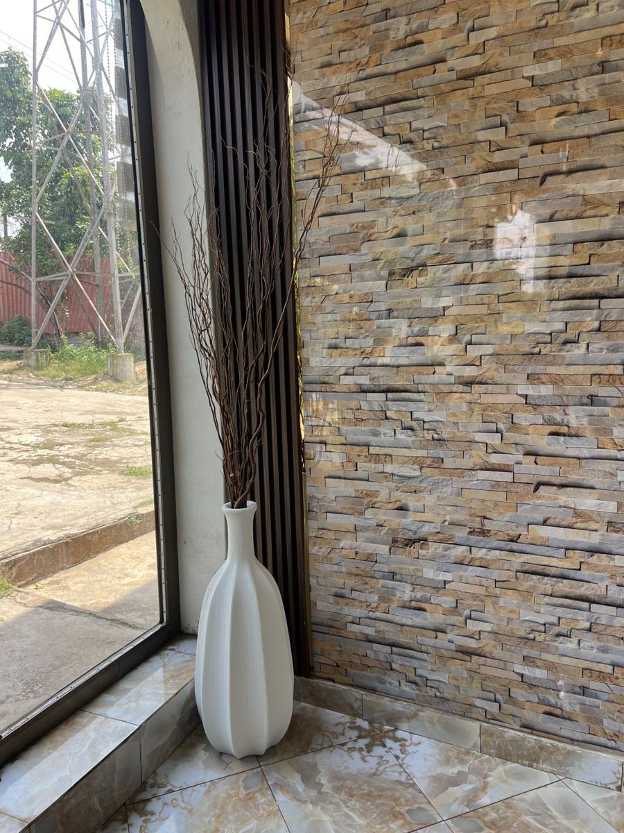 White fluted floor vase with branches
